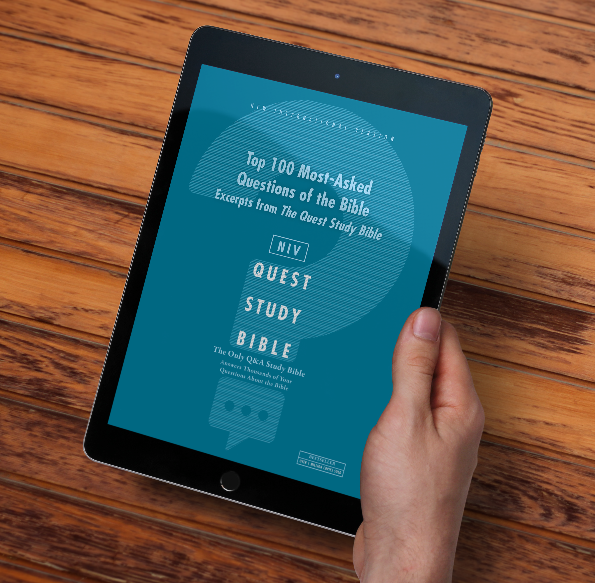 hand holding tablet showing the NIV Quest Study Bible eBook